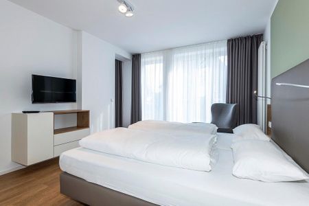 Apartmentvilla Anna See Apartmentvilla Anna See 1-17 Langeoog - Schlafzimmer mit Doppelbett und TV