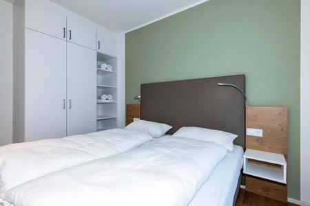 Apartmentvilla Anna See Apartmentvilla Anna See 1-17 Langeoog - Schlafzimmer mit Doppelbett und Kleiderschrank