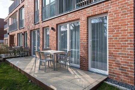 Apartmentvilla Anna See Apartmentvilla Anna See 1-17 Langeoog - Terrasse mit Tisch und Sitzmöglichkeiten
