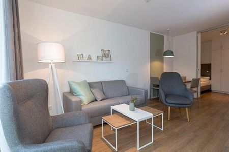 Apartmentvilla Anna See Apartmentvilla Anna See 2-01 Langeoog - Wohn-Essbereich mit Couch und Sessel