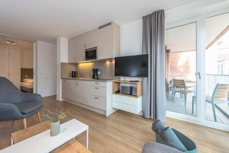 Apartmentvilla Anna See Apartmentvilla Anna See 2-01 Langeoog - Wohn-Essbereich mit Zugang zum Balkon