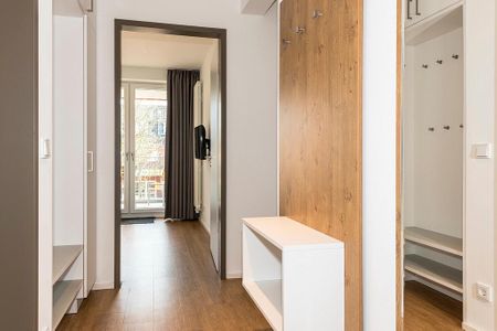 Apartmentvilla Anna See Apartmentvilla Anna See 2-01 Langeoog - Flur mit Garderobe und Spiegel