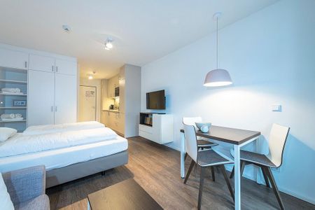 Apartmentvilla Anna See Apartmentvilla Anna See 2-03 Langeoog - Wohn-Schlafbereich mit Sitzgelegenheit und TV