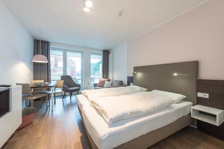 Apartmentvilla Anna See Apartmentvilla Anna See 2-05 Langeoog - Wohn-Essbereich mit Doppelbett
