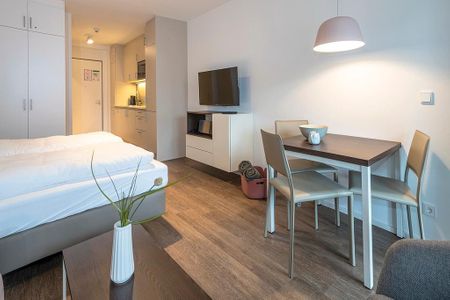 Apartmentvilla Anna See Apartmentvilla Anna See 2-05 Langeoog - Wohn-Essbereich mit Couch und Esstisch
