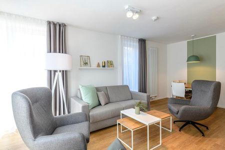 Apartmentvilla Anna See Apartmentvilla Anna See 1-10 Langeoog - Wohnbereich mit Couch und Sessel
