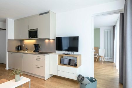 Apartmentvilla Anna See Apartmentvilla Anna See 1-10 Langeoog - Wohn-Essbereich mit Küchenzeile und TV