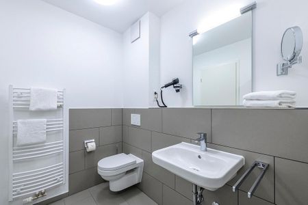 Deichhäuser Anna Küste Deichhäuser Anna Küste 1-11 Bensersiel - Badezimmer mit Waschtisch und WC
