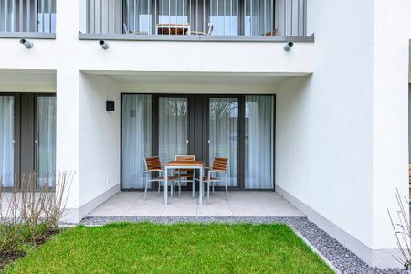Deichhäuser Anna Küste Deichhäuser Anna Küste 1-12 Bensersiel - Terrasse mit Garten und Sitzgelegenheiten