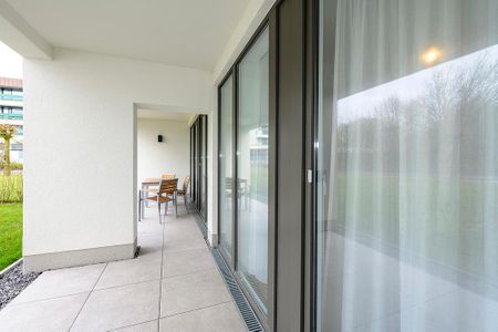 Deichhäuser Anna Küste Deichhäuser Anna Küste 1-13 Bensersiel - Terrasse mit Garten und Sitzgelegenheiten
