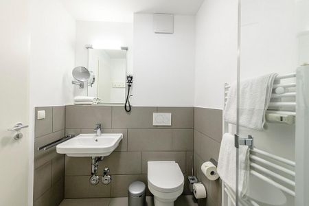 Deichhäuser Anna Küste Deichhäuser Anna Küste 1-22 Bensersiel - Badezimmer mit Waschtisch, WC und Dusche