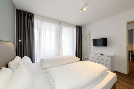 Deichhäuser Anna Küste Deichhäuser Anna Küste 1-24 Bensersiel - Schlafzimmer mit Doppelbett und TV