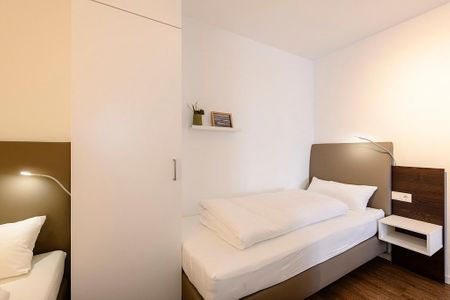 Deichhäuser Anna Küste Deichhäuser Anna Küste 1-31 Bensersiel - Schlafzimmer mit zwei Einzelbetten und Kleiderschrank
