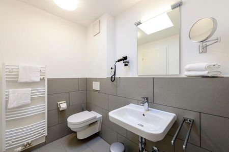 Deichhäuser Anna Küste Deichhäuser Anna Küste 1-31 Bensersiel - Badezimmer mit Waschtisch und WC