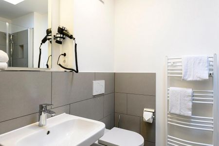 Deichhäuser Anna Küste Deichhäuser Anna Küste 1-32 Bensersiel - Badezimmer mit Waschtisch und WC