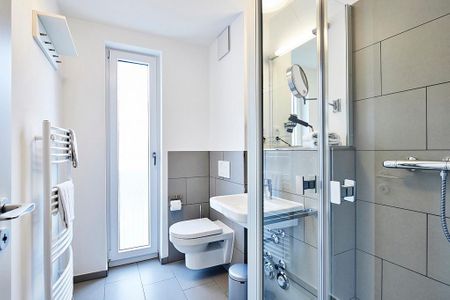 Deichhäuser Anna Küste Deichhäuser Anna Küste 2-20 Bensersiel - Badezimmer mit Waschtisch, WC und Dusche