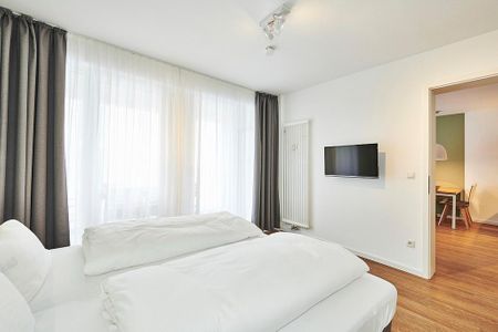 Deichhäuser Anna Küste Deichhäuser Anna Küste 2-24 Bensersiel - Schlafzimmer mit Doppelbett und TV