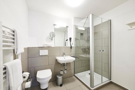 Deichhäuser Anna Küste Deichhäuser Anna Küste 2-24 Bensersiel - Badezimmer mit Waschtisch, WC und Dusche