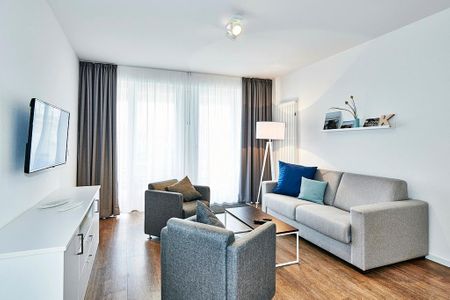 Deichhäuser Anna Küste Deichhäuser Anna Küste 3-10 Bensersiel - Wohn/Essbereich mit Sesseln, Couch und TV