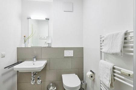 Deichhäuser Anna Küste Deichhäuser Anna Küste 3-12 Bensersiel - Badezimmer mit Waschtisch und WC