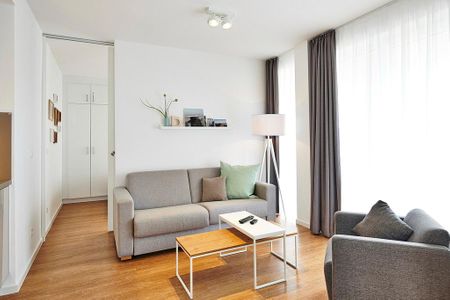 Deichhäuser Anna Küste Deichhäuser Anna Küste 3-13 Bensersiel - Wohnbereich mit Couch, Sessel