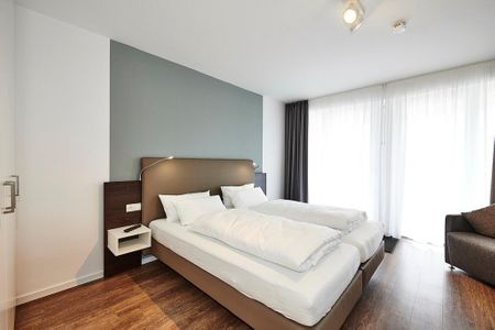 Deichhäuser Anna Küste Deichhäuser Anna Küste 3-21 Bensersiel - Schlafzimmer mit Doppelbett
