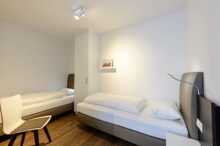 Deichhäuser Anna Küste Deichhäuser Anna Küste 3-21 Bensersiel - Schlafzimmer mit zwei Einzelbetten
