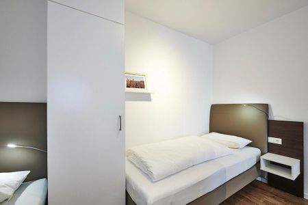Deichhäuser Anna Küste Deichhäuser Anna Küste 3-21 Bensersiel - Schlafzimmer mit zwei Einzelbetten