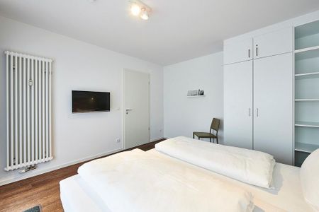 Deichhäuser Anna Küste Deichhäuser Anna Küste 3-24 Bensersiel - Schlafzimmer mit Doppelbett und Flatscreen TV - gbmv0-01 - Großenbrode