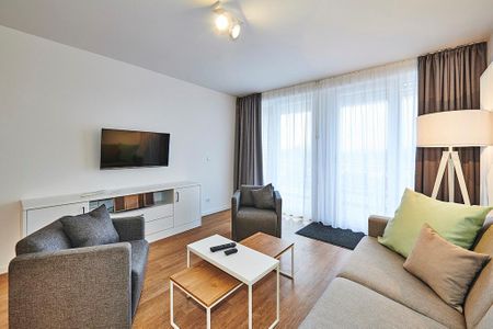 Deichhäuser Anna Küste Deichhäuser Anna Küste 3-30 Bensersiel - Wohnbereich mit Flatscreen-TV