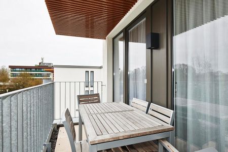 Deichhäuser Anna Küste Deichhäuser Anna Küste 3-30 Bensersiel - Überdachter Balkon mit Sitzgelegenheit