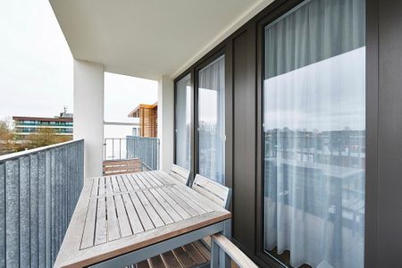 Deichhäuser Anna Küste Deichhäuser Anna Küste 3-31 Bensersiel - Überdachter Balkon mit Sitzgelegenheit