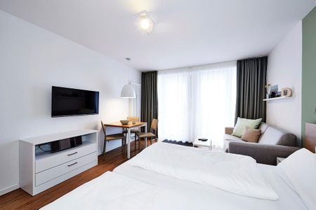 Deichhäuser Anna Küste Deichhäuser Anna Küste 3-32 Bensersiel - Schlafbereich mit Doppelbett und Flatscreen TV