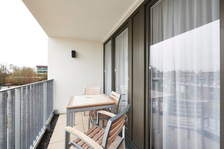Deichhäuser Anna Küste Deichhäuser Anna Küste 3-32 Bensersiel - Überdachter Balkon mit Sitzgelegenheit