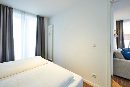 Deichhäuser Anna Küste Deichhäuser Anna Küste 3-33 Bensersiel - Schlafzimmer mit Doppelbett