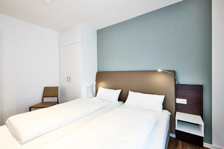 Deichhäuser Anna Küste Deichhäuser Anna Küste 3-33 Bensersiel - Schlafzimmer mit Doppelbett