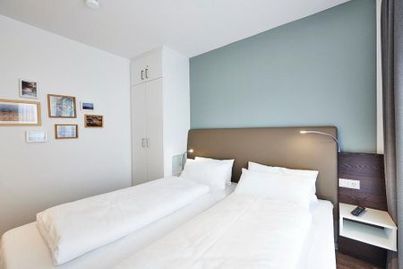 Deichhäuser Anna Küste Deichhäuser Anna Küste 3-33 Bensersiel - Schlafzimmer mit Doppelbett