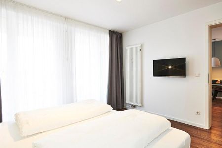 Deichhäuser Anna Küste Deichhäuser Anna Küste 3-34 Bensersiel - Schlafzimmer mit Doppelbett und Zugang zum Balkon