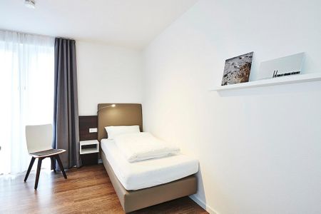 Deichhäuser Anna Küste Deichhäuser Anna Küste 3-34 Bensersiel - Schlafzimmer mit zwei Einzelbetten