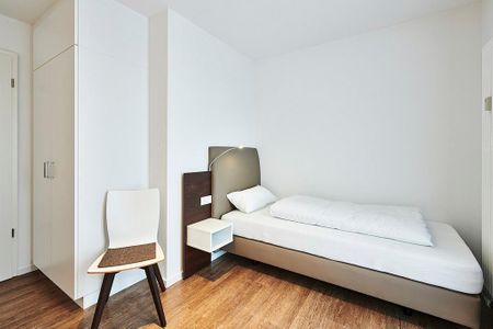 Deichhäuser Anna Küste Deichhäuser Anna Küste 3-34 Bensersiel - Schlafzimmer mit zwei Einzelbetten