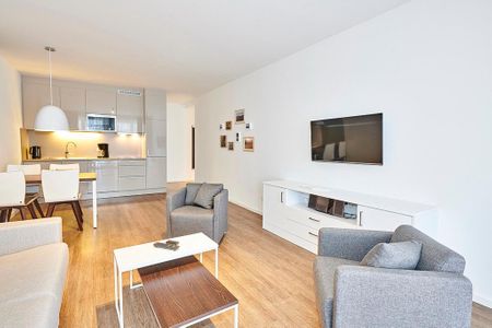 Deichhäuser Anna Küste Deichhäuser Anna Küste 4-10 Bensersiel - Wohnbereich mit Flatscreen-TV