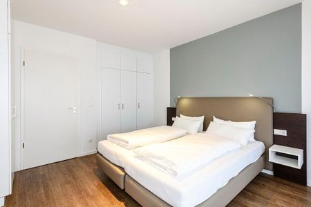 Deichhäuser Anna Küste Deichhäuser Anna Küste 4-11 Bensersiel - Schlafzimmer mit Doppelbett und Kleiderschrank
