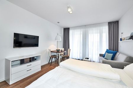 Deichhäuser Anna Küste Deichhäuser Anna Küste 4-12 Bensersiel - Schlafbereich mit Flatscreen-TV