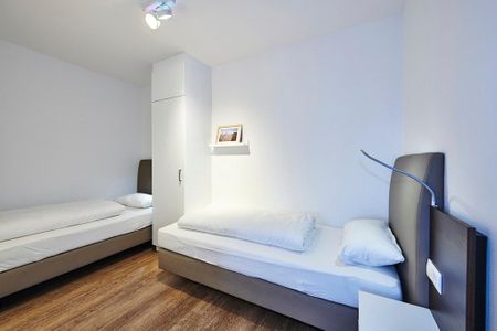 Deichhäuser Anna Küste Deichhäuser Anna Küste 4-21 Bensersiel - Schlafzimmer mit zwei Einzelbetten