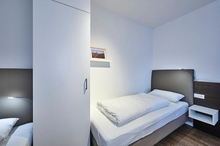 Deichhäuser Anna Küste Deichhäuser Anna Küste 4-21 Bensersiel - Schlafzimmer mit zwei Einzelbetten