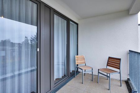 Deichhäuser Anna Küste Deichhäuser Anna Küste 4-21 Bensersiel - Überdachte Terrasse mit Sitzgelegenheit