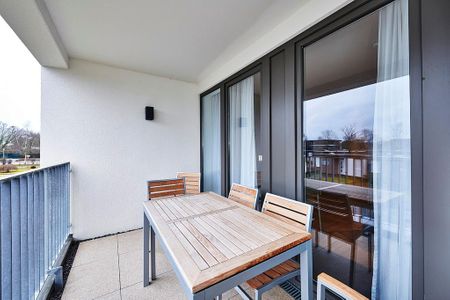 Deichhäuser Anna Küste Deichhäuser Anna Küste 4-23 Bensersiel - Überdachter Balkon mit Sitzgelegenheit