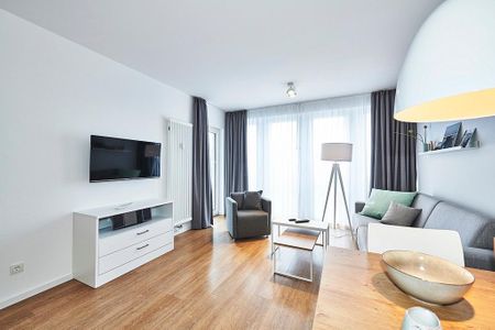 Deichhäuser Anna Küste Deichhäuser Anna Küste 4-24 Bensersiel - Wohn-Essbereich mit Zugang zum Balkon