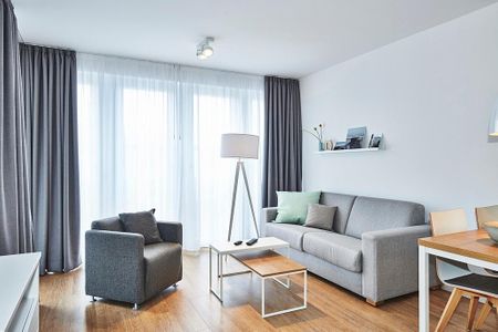Deichhäuser Anna Küste Deichhäuser Anna Küste 4-24 Bensersiel - Wohnbereich mit Sofa, Sessel und Couchtisch