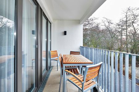 Deichhäuser Anna Küste Deichhäuser Anna Küste 4-24 Bensersiel - Überdachter Balkon mit Sitzgelegenheit